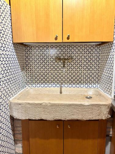 a kitchen with a sink and a counter top at Casa delle gondole in Venice