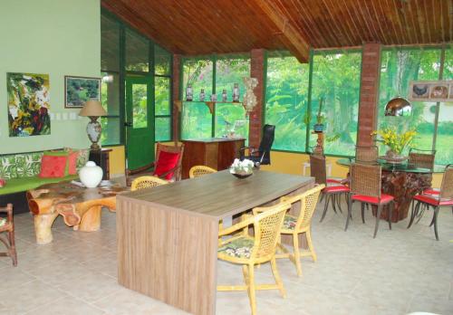 a dining room with a table and some chairs at Eco Charme da Bodoquena in Bodoquena