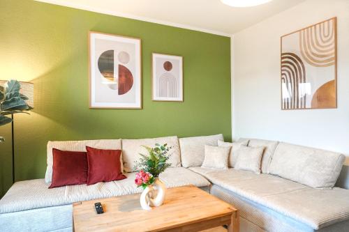 a living room with a couch and a table at Ferienwohnung Elbhang mit Stellplatz in Königstein an der Elbe