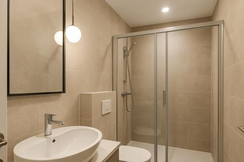 a bathroom with a sink and a shower at Hannover Group Apartment in Hannover