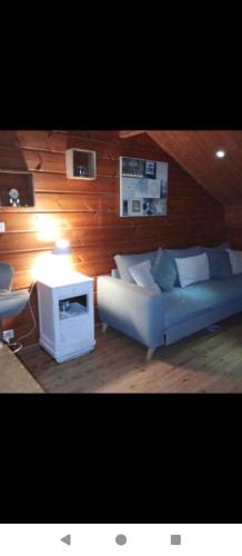 a living room with a couch and a table at studio in Puessans