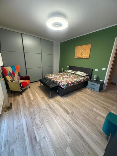 a bedroom with a bed and a chair at Suite Vittoria in Ortona