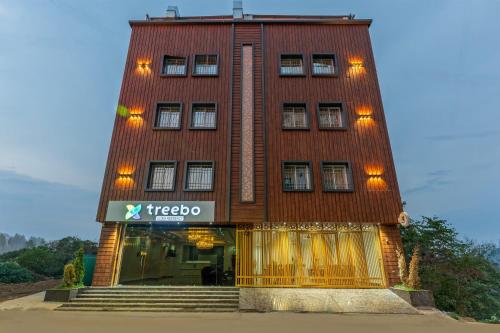 a building with a sign that reads treeo at Treebo Sloka Residency in Rānchī
