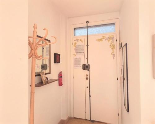 a room with a door and a fire extinguisher at Un Raggio di Sole - a due passi dal mare in Montesilvano
