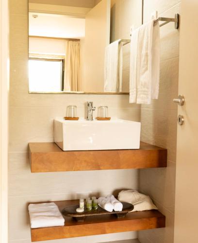 a bathroom with a sink and a mirror at Casa d'Amares in Amares