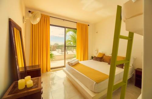a bedroom with a bunk bed and a large window at Finca San Pedro in La Mesa