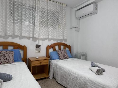 apartamento playa de Levante,parking, aire dos habitaciones y dos baños vistas playa y jardin