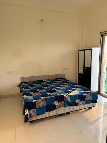 a bedroom with a bed in a room at Nahta's Farm in Indore