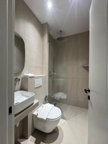 a bathroom with a toilet and a sink at Elios Near Centre Apartment in Tirana