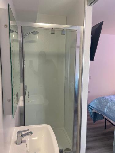 a bathroom with a shower and a sink at The Old Printworks, Kirkwall in Orkney