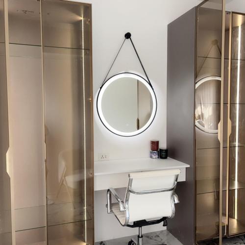 a bathroom with a shower and a mirror at MeCasa in Mactan Island