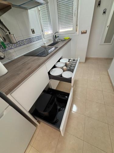 a kitchen with an open drawer in a counter at Taína La Encina in Vícar