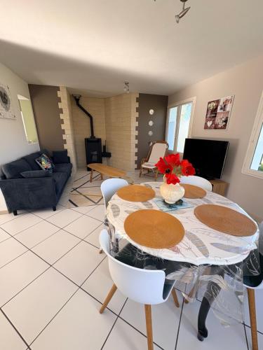 a dining room with a table and chairs at Mon calme in Arques-la-Bataille