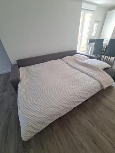 a large bed in a room with at Keo Home in Arbent