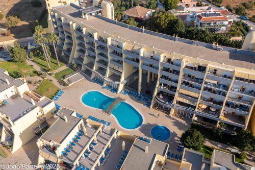 an aerial view of a hotel with a pool at Meia Praia Terrace in Lagos