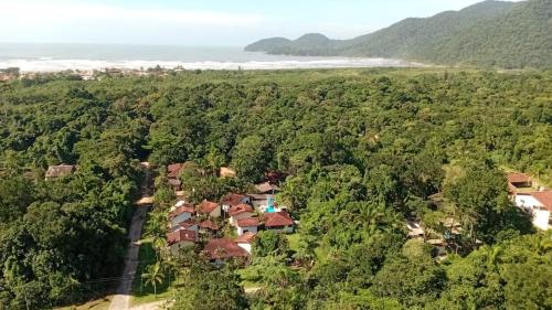 an aerial view of a house in the forest at Pousada Porto Aventura - Chalés da Luci -Guaraú 13-98159-2115 in Peruíbe