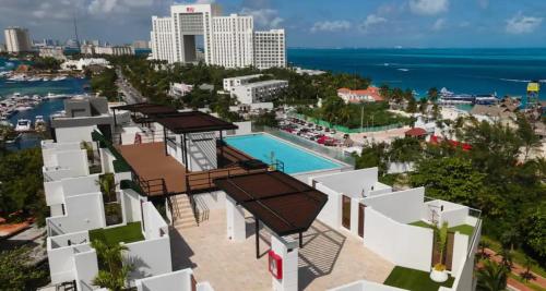 an aerial view of a resort with a swimming pool at Beautiful sea view apartment in the Hotel Zone Cancun in Cancún