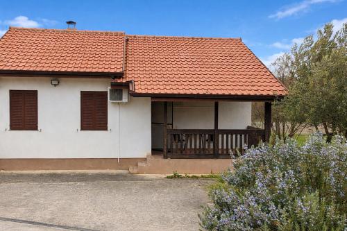 a white house with an orange roof at Međugorje Quit Hideaway in Botići