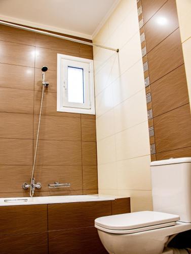 a bathroom with a toilet and a shower at Marathon Coastal House in Marathon