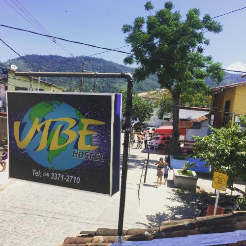 a sign for a hostel on a street at Vibe Hostel Paraty in Paraty