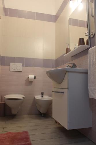 a bathroom with a sink and a toilet at B&B Raggi d'Ischia - nuova gestione 2026 in Casamicciola Terme
