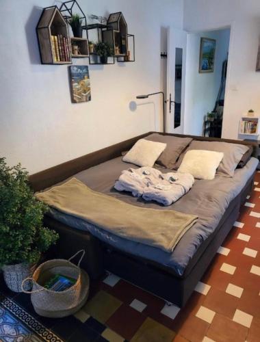 a large bed sitting in a living room at Le paradis bleu azur in Ensuès-la-Redonne
