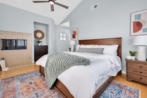 a bedroom with a large bed and a tv at Near Oceanside Pier! Pirate in Oceanside
