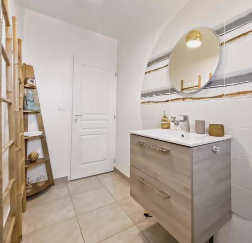 a bathroom with a sink and a mirror at Maison de charme, Gorges Ardèche et Nature in Vagnas