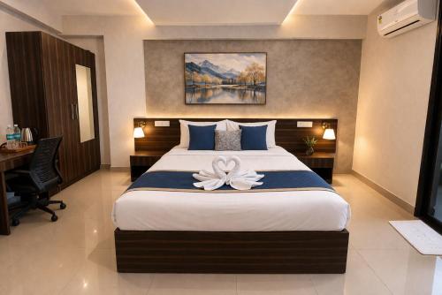 a bedroom with a bed with a flower on it at Harvey's Brookefield-With Free Car Parking in Bangalore