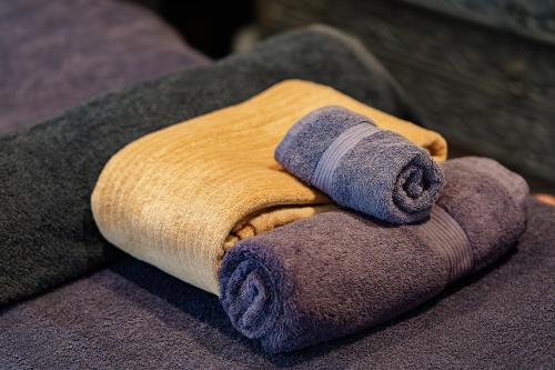a rolled up towel sitting on top of a couch at Villa Plagniau in Rixensart