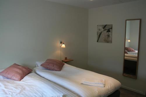 Katil atau katil-katil dalam bilik di Flygplatshotellet