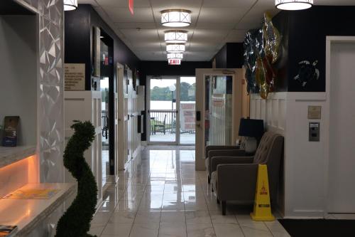 a lobby with a waiting room with couches and a yellow cone at Baymont on the lake by Wyndham Hot Springs in Hot Springs