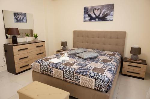 a bedroom with a bed and two nightstands and a bed sidx sidx sidx at IVAN house - TERRASINI SICILIA in Terrasini
