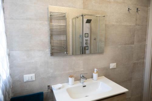 a bathroom with a sink and a mirror at IVAN house - TERRASINI SICILIA in Terrasini