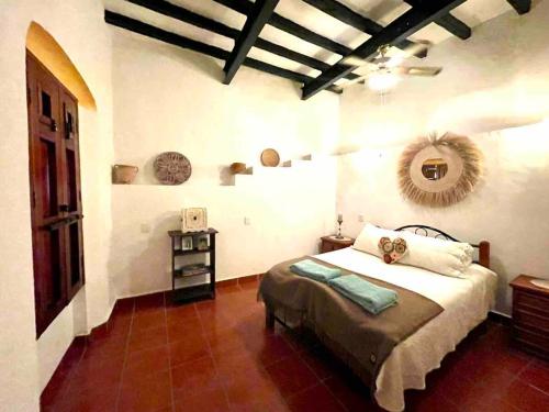a bedroom with a bed in a room at Casa Adobe Balcony Breathtaking Cathedral Views in Taxco de Alarcón