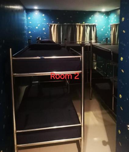a room with two bunk beds with at McHanns Place in Antipolo
