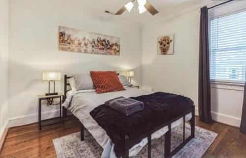 a bedroom with a bed and a window at Sweet Home in Greenville