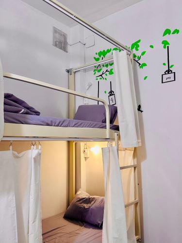 a bunk bed in a room with two bunk beds at Da Nang Sleepbox & Dorm in Danang