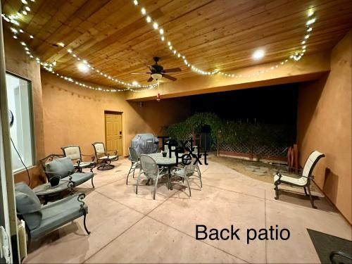 a patio with a table and chairs and a ceiling at Spacious Home in Page