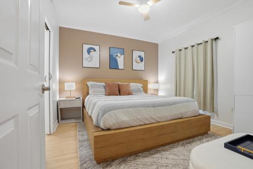 a bedroom with a bed with a wooden frame at Splash Resort, 16th floor, Oceanfront, 1BR Sleeps 6, Lazy River & Water Park in Panama City Beach