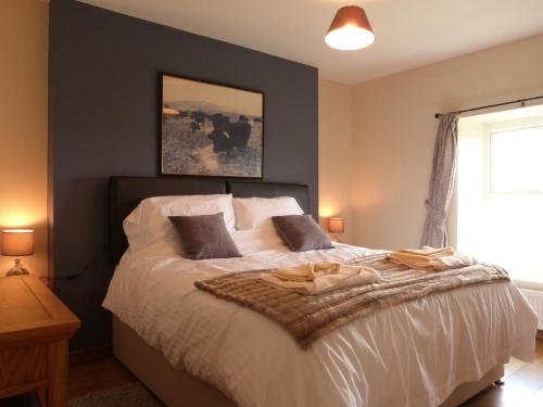 En eller flere senge i et værelse på Gwarcwm Uchaf