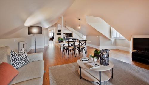 a living room with a couch and a table at Lisbon Five Stars Apartments Bica in Lisbon
