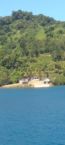 a small island in the middle of a body of water at Saumualevu in Kavala