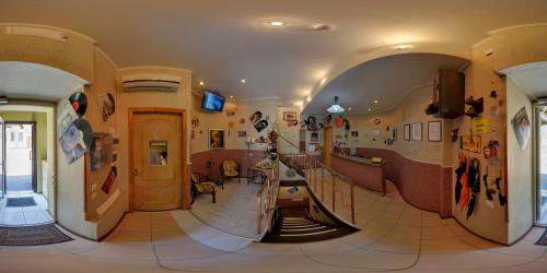 a hallway with a spiral staircase in a building at YELLOW UNLIMITED HOTEL 4 in Kharkiv