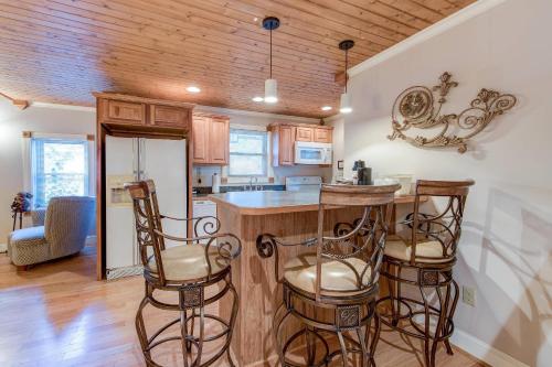 a kitchen with a bar with stools in it at Quality Inn Creekside - Downtown Gatlinburg in Gatlinburg