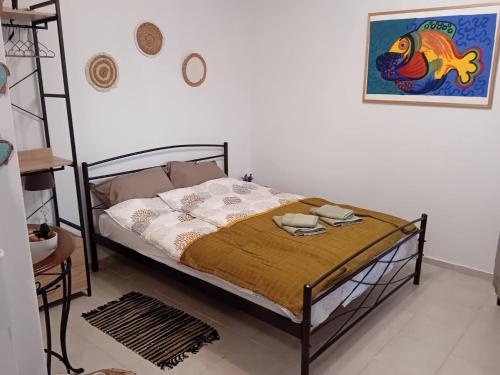 a bedroom with a bed in a white room at Studio Lemoni Peloponnese in Pirgákion