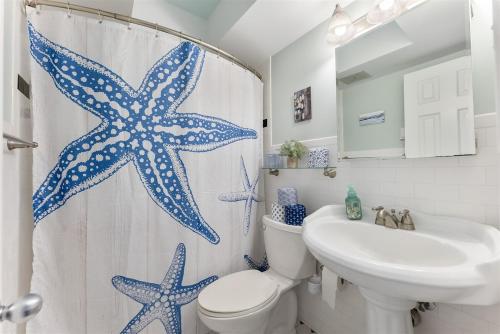 a bathroom with a shower curtain with stars on it at Surfside Getaway with Heated Pool & BBQ Grill in North Wildwood