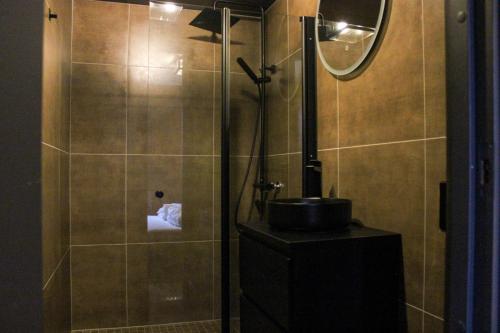 a bathroom with a shower and a sink at Stølstunets samlingssted in Beitostøl