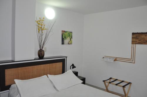 Posteľ alebo postele v izbe v ubytovaní Hotel Meson de las Flores
