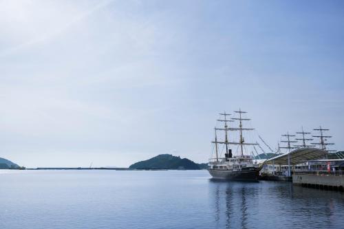 two boats docked at a dock in the water at Fairfield by Marriott Hyogo Awaji Fukura in Minamiawaji